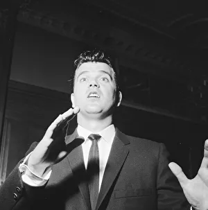 American singer Conway Twitty pictured upon his arrival in London. 6th May 1959
