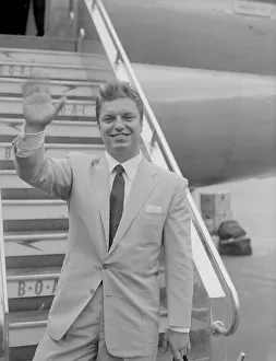 Stairs Prints: American singer Guy Mitchell seen here arriving at London, Heathrow Airport