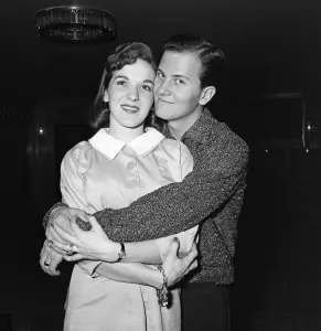01115 Prints: American singer Pat Boone and his wife Shirley pictured a the Dorchester Hotel were they