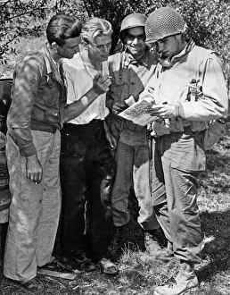 American soldiers liaise with members of the French Resistance during the Allied Invasion