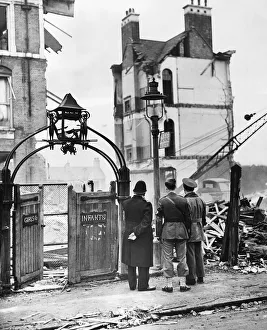 Officer Prints: American soldiers looking at a wrecked school in Sandhurst Road, London