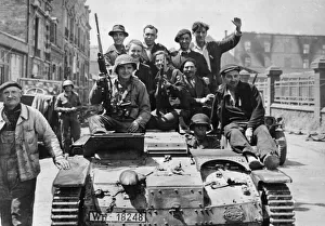 American soldiers of the US Ninth Division and French patriots ride a captured German
