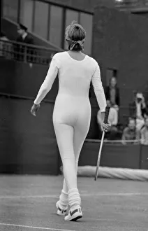 Suit Prints: American tennis player Anne White in action wearing her white skin tight catsuit during