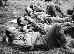 Americans watch the air bombardment which preceeded their invasion of Normandy 1944