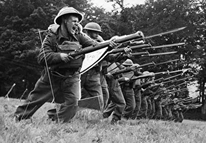 01444 Prints: Amy troops bayonet training in England during the Second World War. September 1943