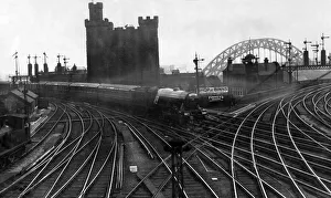 Tracks Prints: With an ancient and modern background - the Flying Scotsman express approaching Newcastle