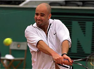 Andre Agassi tennis star in action in the rain during the French Open tennis tournament