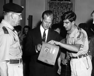 Andre Hobro aged 18, of 279 Birmingham Scout Group at Hall Green explains a map to