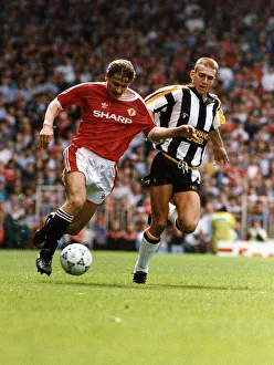 00273 Prints: Andrei Kanchelskis, Manchester United FC Footballer, in tackle with Mark Draper of Notts