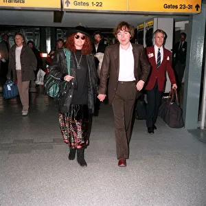 Andrew Lloyd Webber composer songwriter with his wife Sarah Brightman singer at Heathrow