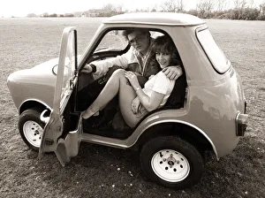 Automobile Prints: Andy Saunders and girlfriend Tina in his rebuilt mini called minihaha in Poole Dorset