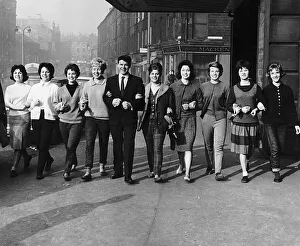 Andy Stewart singer at the Kings Theatre Edinburgh arm in arm with dancers girls from
