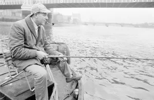 Fisherman Prints: An angler from the Soho Firestation seen here fishing off a barge moored close to