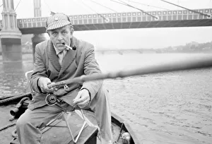 An angler from the Soho Firestation seen here fishing off a barge moored close to