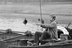 An angler from the Soho Firestation seen here fishing off a barge moored close to