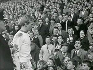 Emotional Prints: Angry Aston Villa fans jeer Manchester United forward Denis Law as he leaves the pitch