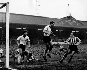00250 Prints: Angus the Burnley right back heads away to relieve a hectic spell of pressure