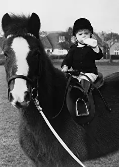 Animals - Children with Horses. Little Charlotte takes a stirrup cup