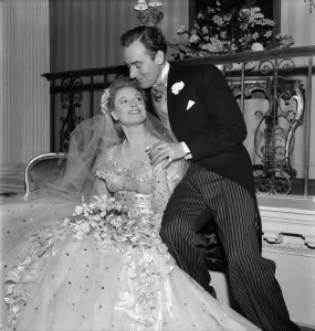 Anna Neagle and Michael Wilding as bride and groom in Maytime in Mayfair