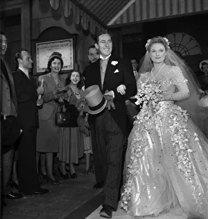 Anna Neagle and Michael Wilding as a bride and groom in Maytime in Mayfair