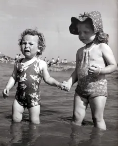Scared Prints: Anne Whitehouse aged 14 months and Jeanette Welsh 3 years old playing at Coney Beach