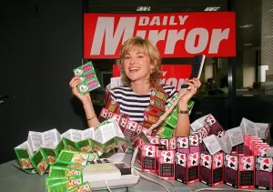 Anthea Turner TV Presenter mans the Daily Mirror National Lottery Scratchcards