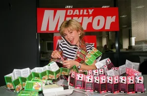 Anthea Turner TV Presenter mans the Daily Mirror National Lottery Scratchcards