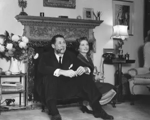 Anthony Quayle and wife Dorothy Hyson sitting by fire place of their London home - 24