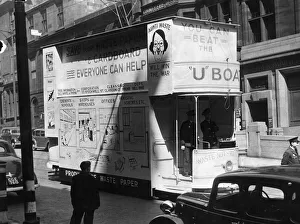 Anti-waste appeal slogans decorate a tram car in Glasgow