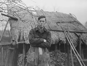 00002 Prints: Antoon van den Hurk Mathematician Standing in front of thatched property with