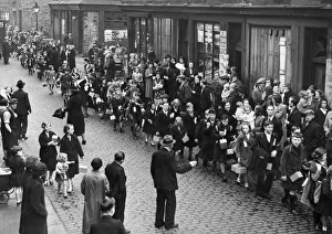 Evacuation Prints: Anxious parents scan the large crowd of pupils of the Sacred Heart School in Liverpool