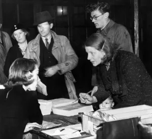 Rationing Prints: Applicants for new ration books and clothing cards at Bath Lane School, Newcastle, to-day