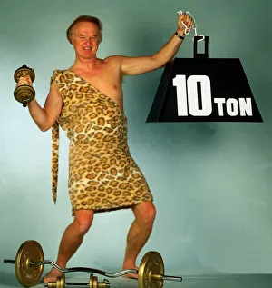 Archie MacPherson Sports Commentator dressed as strongman