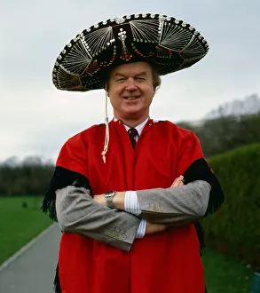 Cape Prints: Archie McPherson Sports Commentator pictured wearing red cape and sombrero hat April 1987
