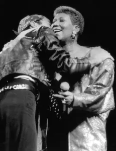 Hugging Prints: Aretha Franklin congratulated by George Michael circa 1985