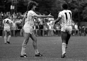 Argentina football star Mario Kempes shakes hands with Garth Crooks in a friendly game