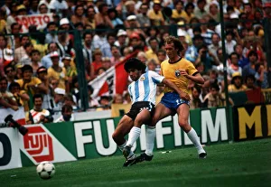 Argentina v Brazil World Cup 1982 football Diego Maradona holds off a challenge