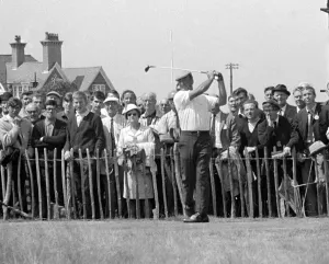 00176 Prints: Argentine golfer Roberto de Vicenzo adriving off watched by spectators during the British