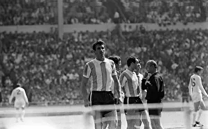 Argentinian players argue with Rudolph Kreitlin 1966 referee during quarter
