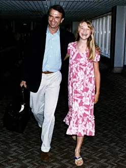 Ariana Richards American Actress and Sam Neill Actor arrive at London Heathrow Airport