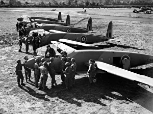 00113 Prints: Army Airborne. Soldier Pilot in the making of Gliders receiving instruction from R. A. F