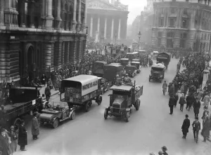 00278 Prints: The army escort a food convoy past commuters making their way to work near The Bank in