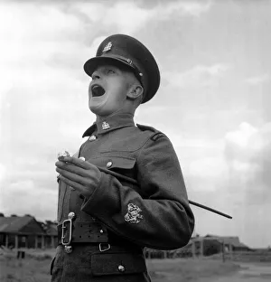 00037 Prints: Army: Soldiers: Communication Sergeant Major Harold Kennard seen here shorting commands