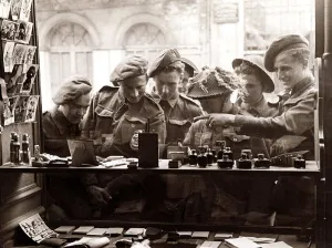 Beauty And Cosmetics Prints: Army Soldiers looking through a shop window - June 1944 for souvenirs to send back
