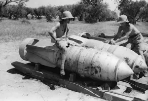 01444 Prints: Army soldiers sit on a German block buster'(3000 pounders