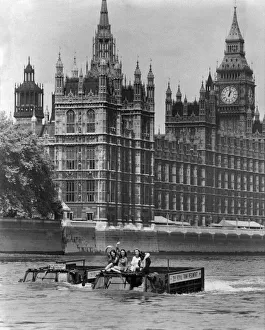 Gothic Prints: Army Vehicles. Amphibious. Two Army trucks transport three waving women through