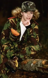 Camouflage Prints: Army Women Female soldier in camouflage resting her chin on her hand - wearing