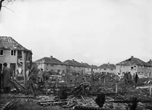 01036 Prints: ARP personnel, Air Raid Wardens and Firemen search the devastation of Rowlston