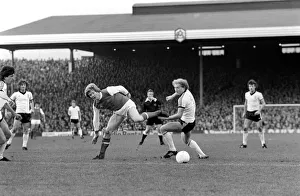 Arsenal (1) v. Ipswich (1). Alan Brazil (right) sends Willie Young the wrong way
