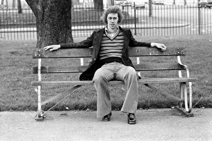 00250 Prints: Arsenal footballer Charlie George sitting on a bench at Hackney marshes February